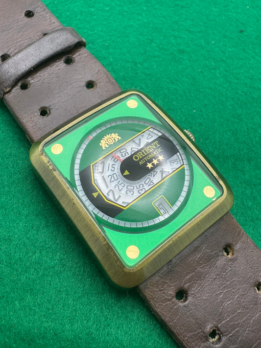 Orient Automatic – green dial, rectangular case – disc display – 35.8 × 40.7 mm