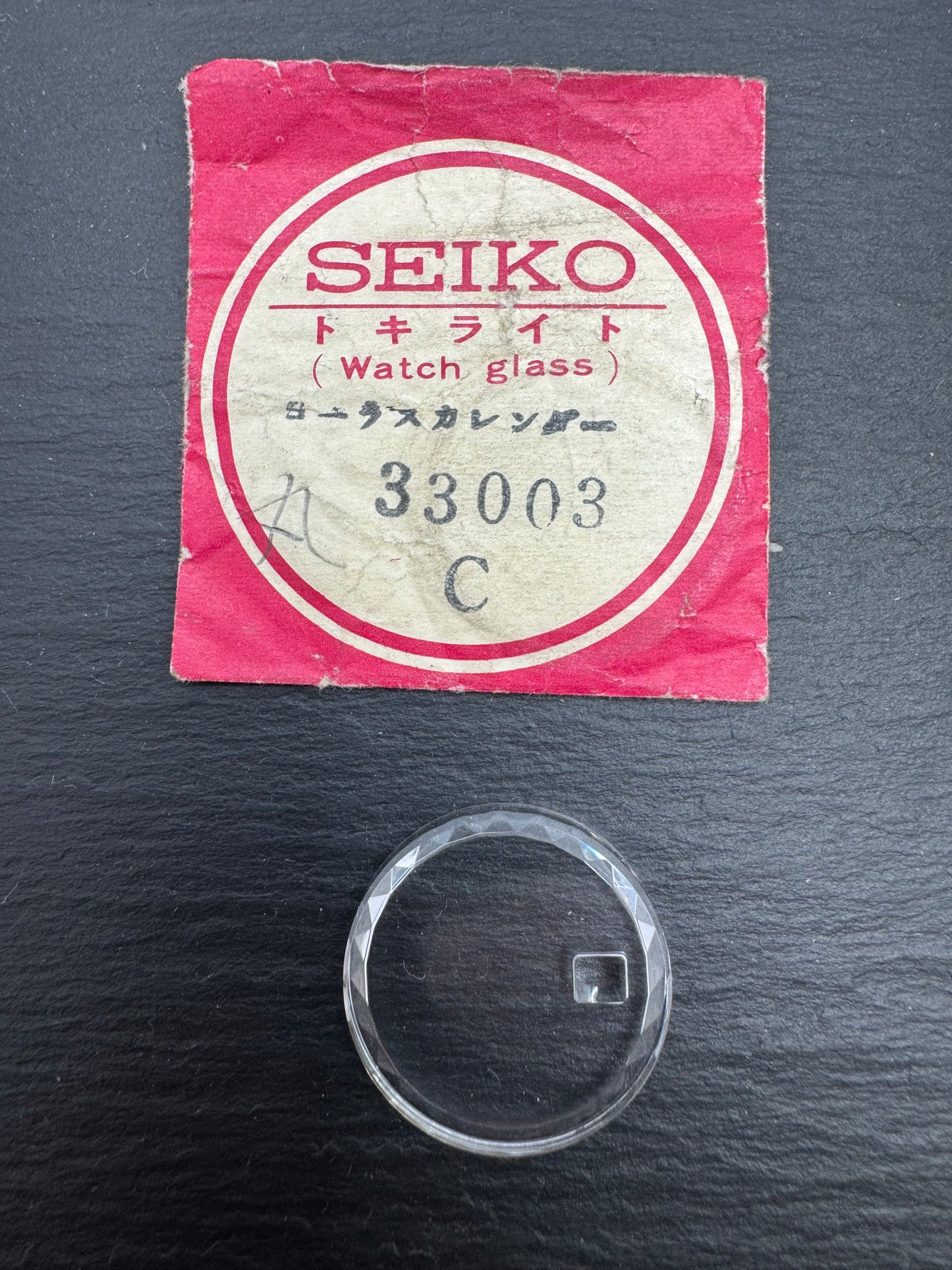 Seiko Tokelaito Crystal 33003 – Ø approx. 22.2 mm – round, faceted cut with date magnifier – mineral glass – Vintage Watch Glass – NOS