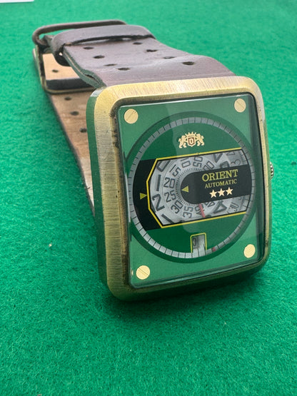 Orient Automatic – green dial, rectangular case – disc display – 35.8 × 40.7 mm