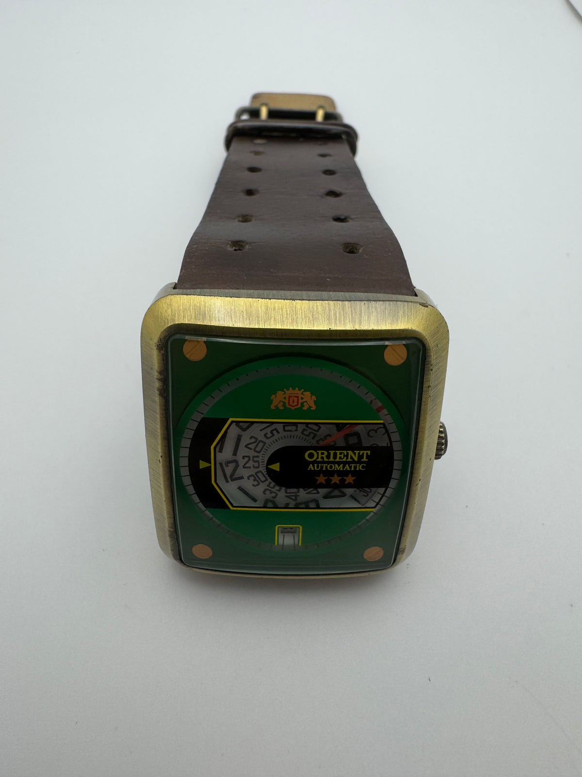 Orient Automatic – green dial, rectangular case – disc display – 35.8 × 40.7 mm