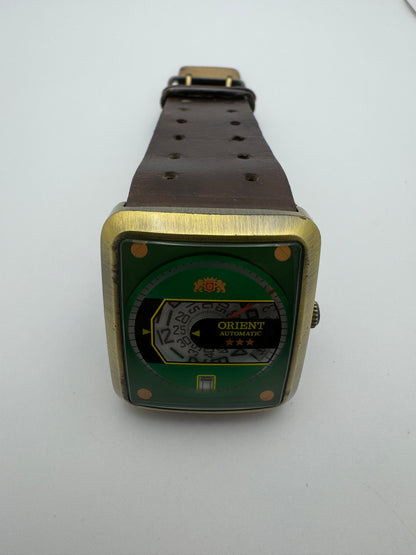 Orient Automatic – green dial, rectangular case – disc display – 35.8 × 40.7 mm