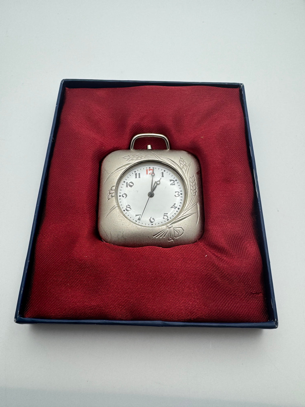 Japanese pocket alarm clock – quartz – engraved folding case with crane and ear of corn motif