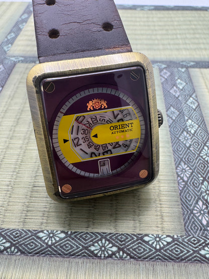 Orient Automatic - burgundy dial, rectangular case 26.5 x 31.1 mm, disc display