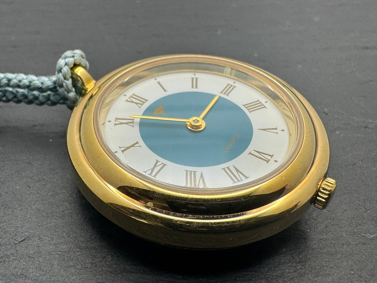 Vintage Pendant Watch · Quartz · Gold-tone with blue Hō-ō enamel back and silk cord · Japan, circa 1970s/80s