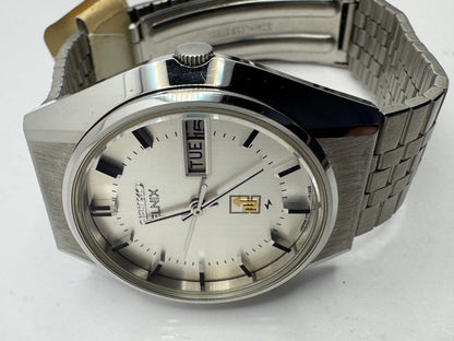 Seiko ELNIX Ref. 0703-7110 · Silbernes Sunburst-Zifferblatt · Mai 1975 · JDM · NOS - Originalband, Hangtag &amp; Anleitung