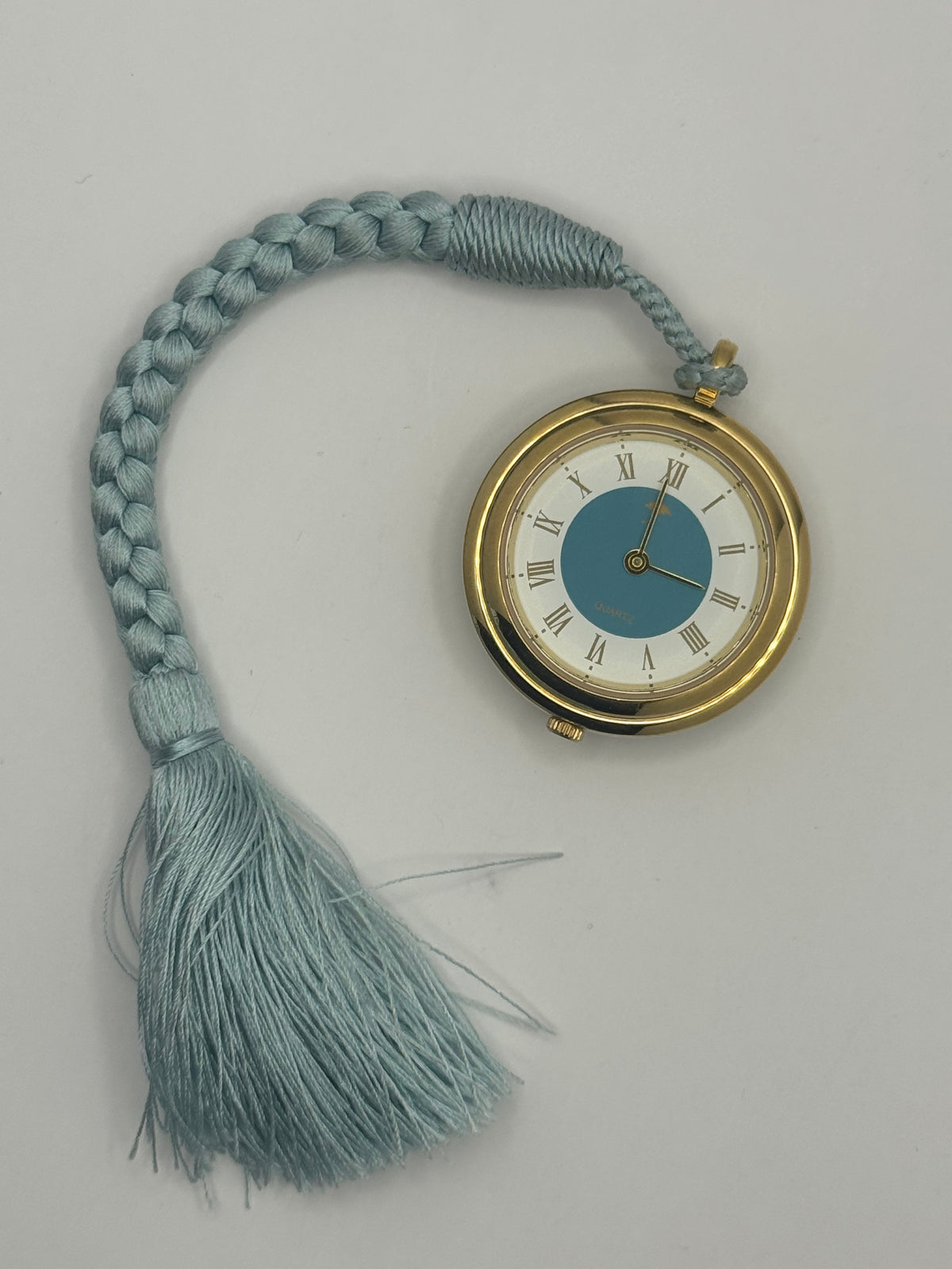 Vintage Pendant Watch · Quartz · Gold-tone with blue Hō-ō enamel back and silk cord · Japan, circa 1970s/80s