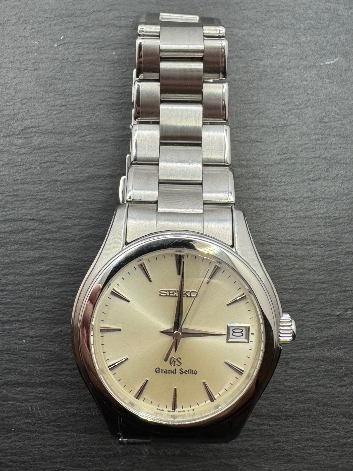 Grand Seiko Quarz SBGX005 / 9F62-0A10 - Champagnerfarbenes Sunburst-Zifferblatt · Original Stahlband mit GS-Schließe · Februar 2004