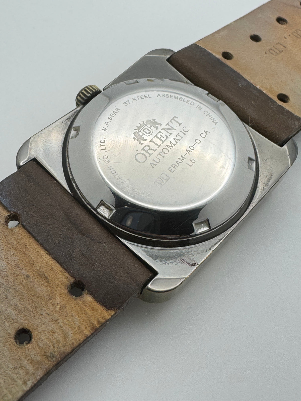 Orient Automatic – green dial, rectangular case – disc display – 35.8 × 40.7 mm