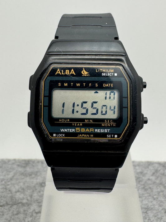 ALBA Digital W401-4160 „Lithium" – November 1990 – schwarz-goldene JDM-Digitaluhr – revidiert, neues Band