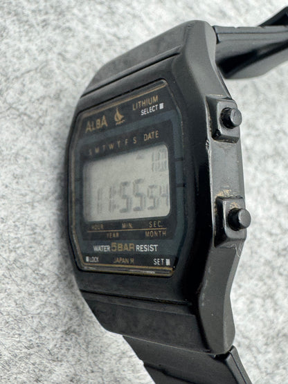 ALBA Digital W401-4160 „Lithium" – November 1990 – schwarz-goldene JDM-Digitaluhr – revidiert, neues Band