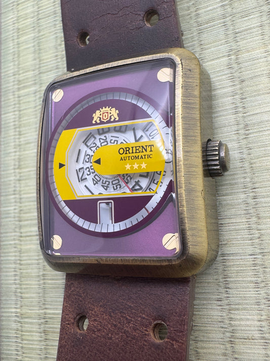 Orient Automatic - burgundy dial, rectangular case 26.5 x 31.1 mm, disc display
