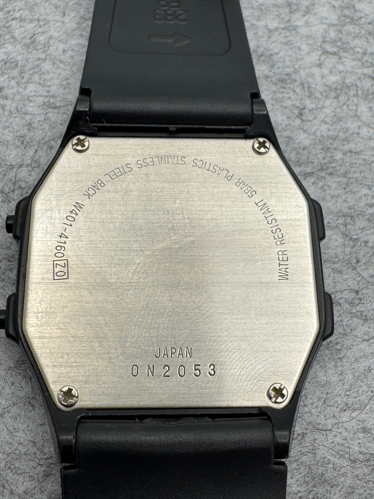 ALBA Digital W401-4160 „Lithium" – November 1990 – schwarz-goldene JDM-Digitaluhr – revidiert, neues Band