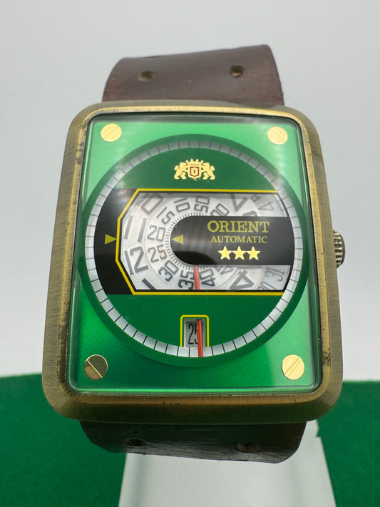 Orient Automatic – green dial, rectangular case – disc display – 35.8 × 40.7 mm