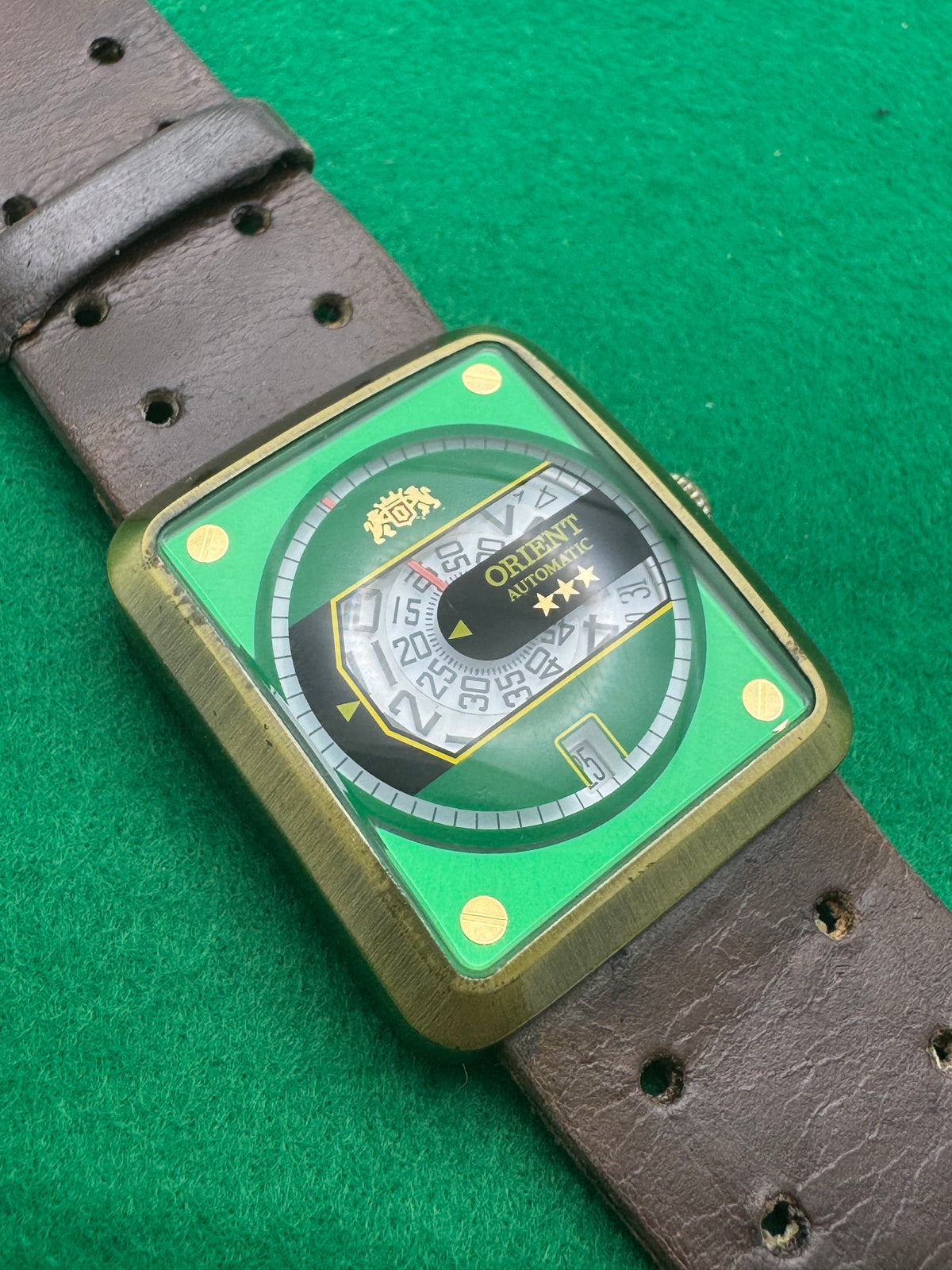 Orient Automatic – green dial, rectangular case – disc display – 35.8 × 40.7 mm