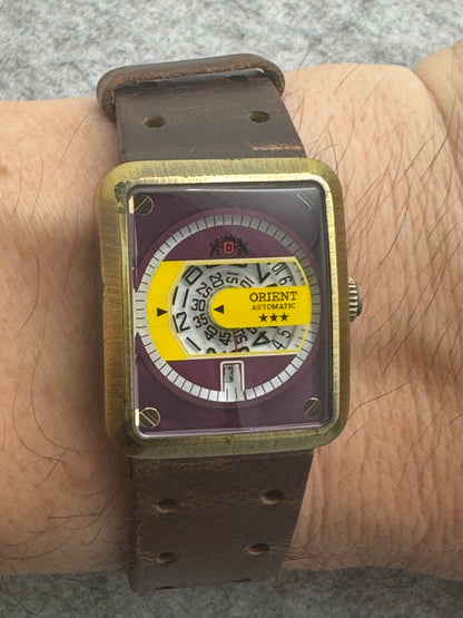 Orient Automatic - burgundy dial, rectangular case 26.5 x 31.1 mm, disc display